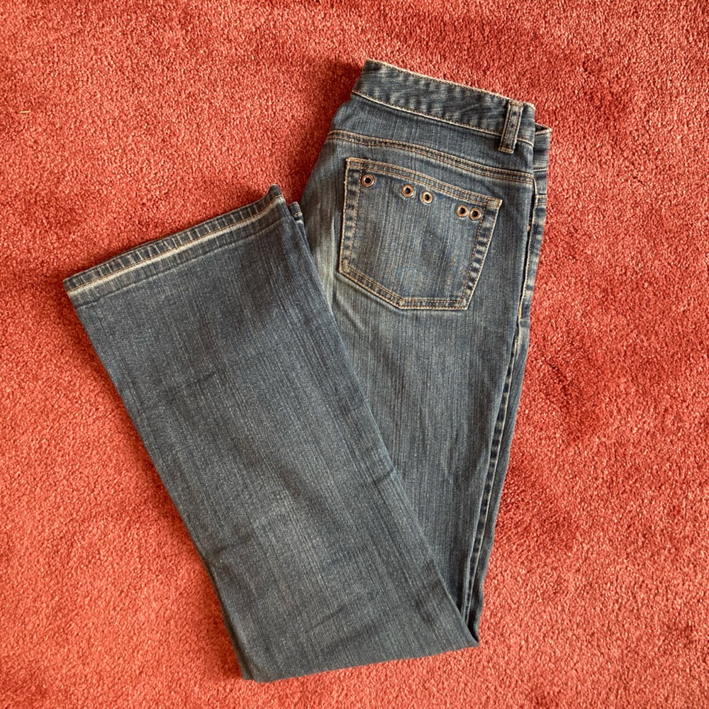 MICHAEL KORS low-rise bootcut jeans, medium wash. Unique pocket detail.